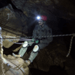 Picture of the guide lowering the participants down to the cave floor