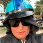 The  Hostel Mom selfi wearing a helmet , sweatshirt hoodie and sunglasses as a disguise 