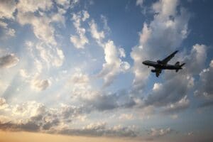 Airplane flying in the sky above Dulles Airport in Virginia, USA 