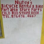 Nutsy's bike  contact information painted on the outside of the shop