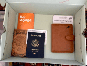 Travel documents including passport and COVID vaccination card 