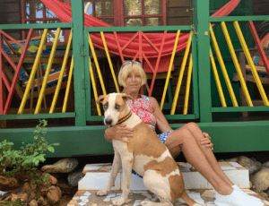 Sue McKenzie, owner of the Judy House, and her dog Frankie